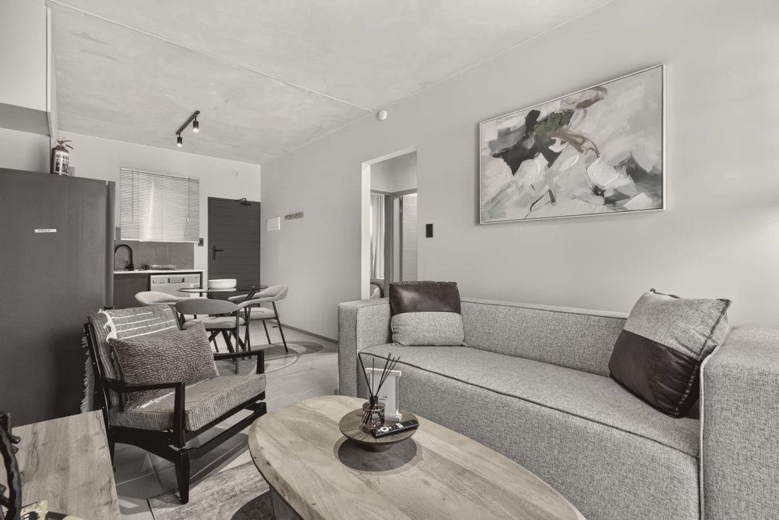The living area at Casa Sunshine, with a canvas above the sofa